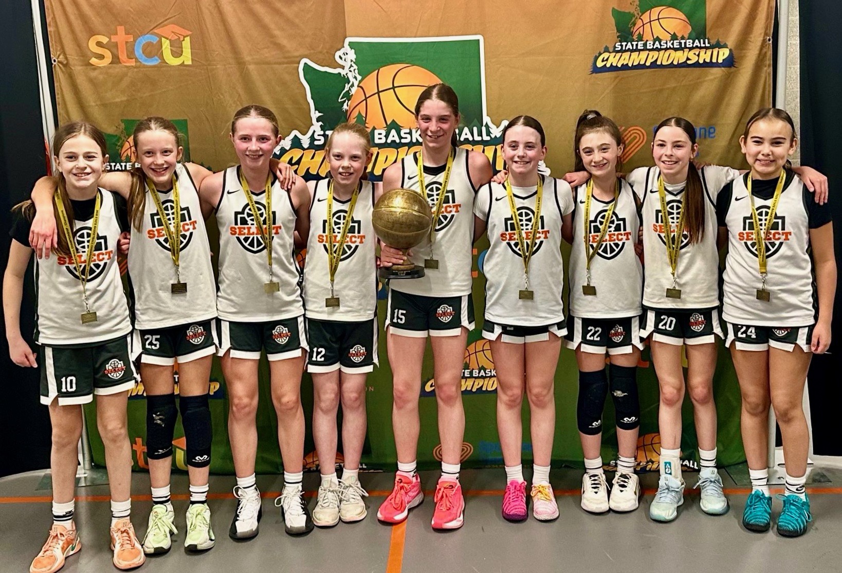 Northwest Blazers 5th grade girls team celebrating a Washington State championship.