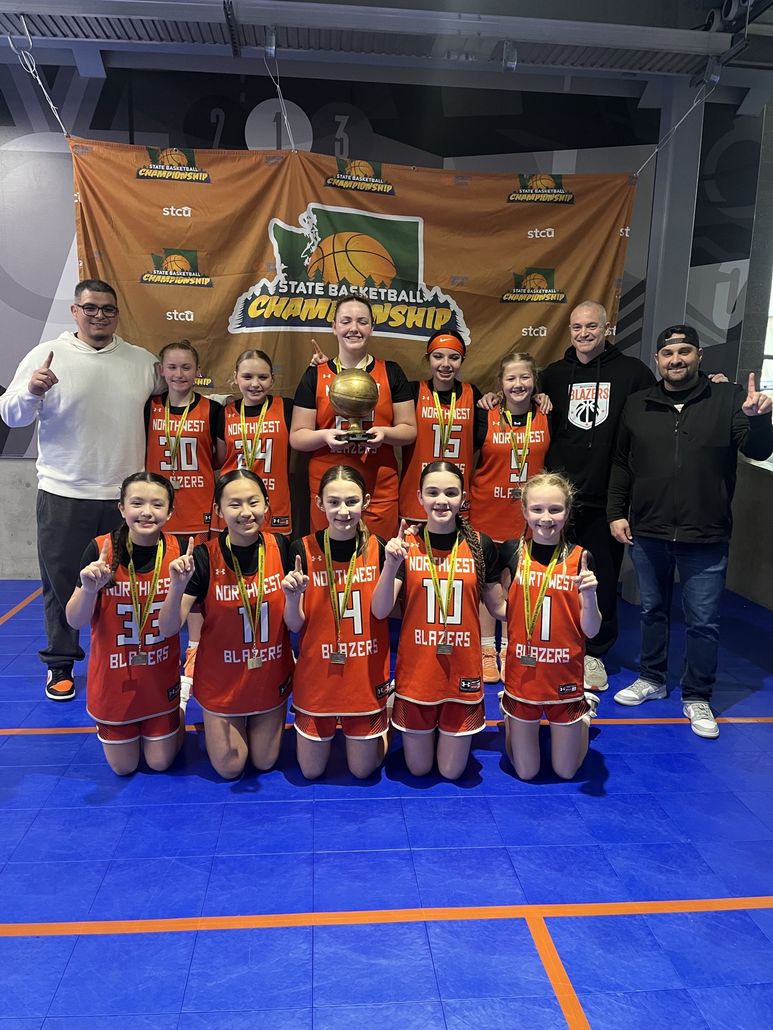 Northwest Blazers 6th grade girls team celebrating a Washington State championship.