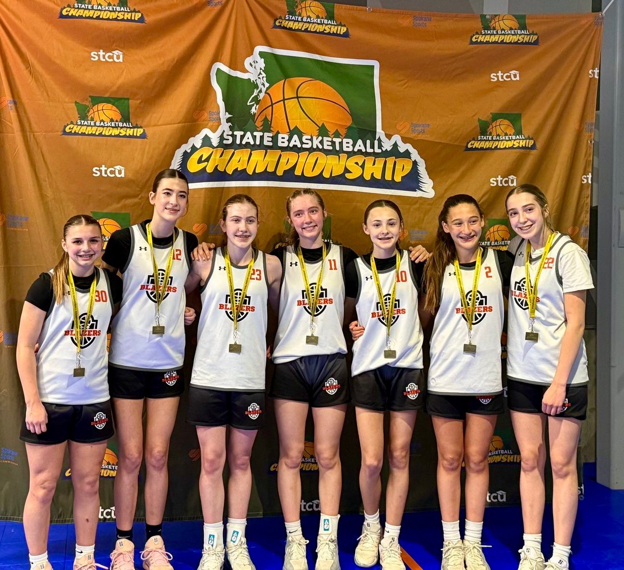 Northwest Blazers 7th grade girls team celebrating a Washington State championship.
