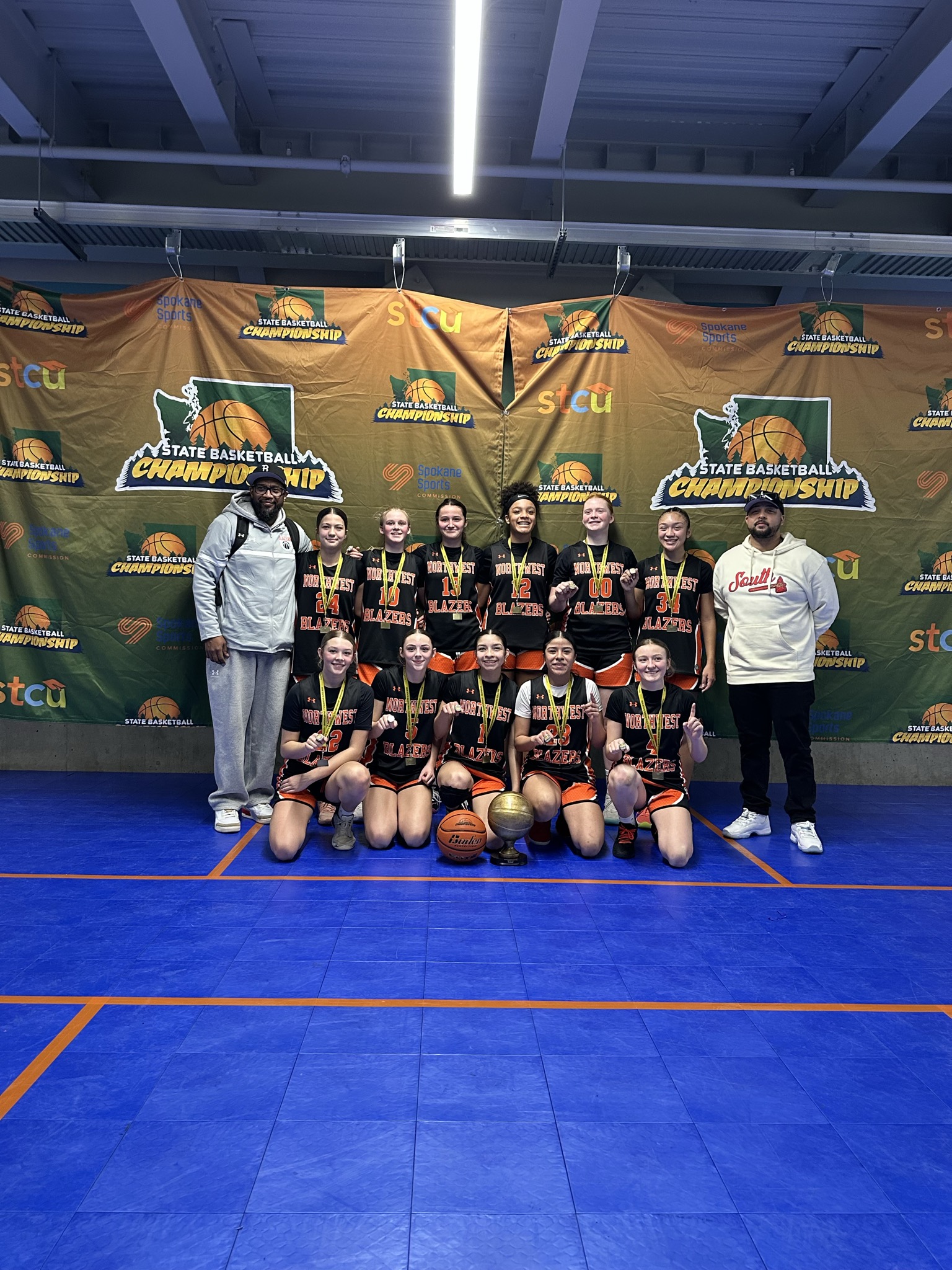 Northwest Blazers 8th grade girls team celebrating a Washington State championship.