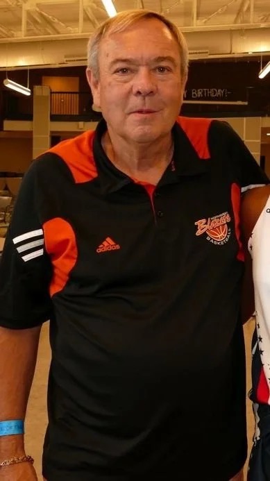 Steve Klees in a Northwest Blazers polo at a gym event.
